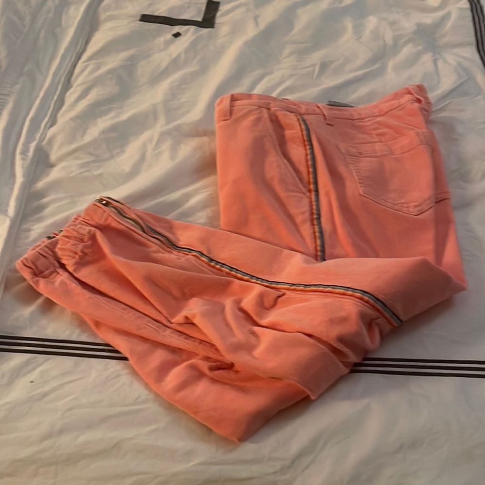 Sundry women’s corduroy pants with zipper ankle. Multicolored side strip detail.